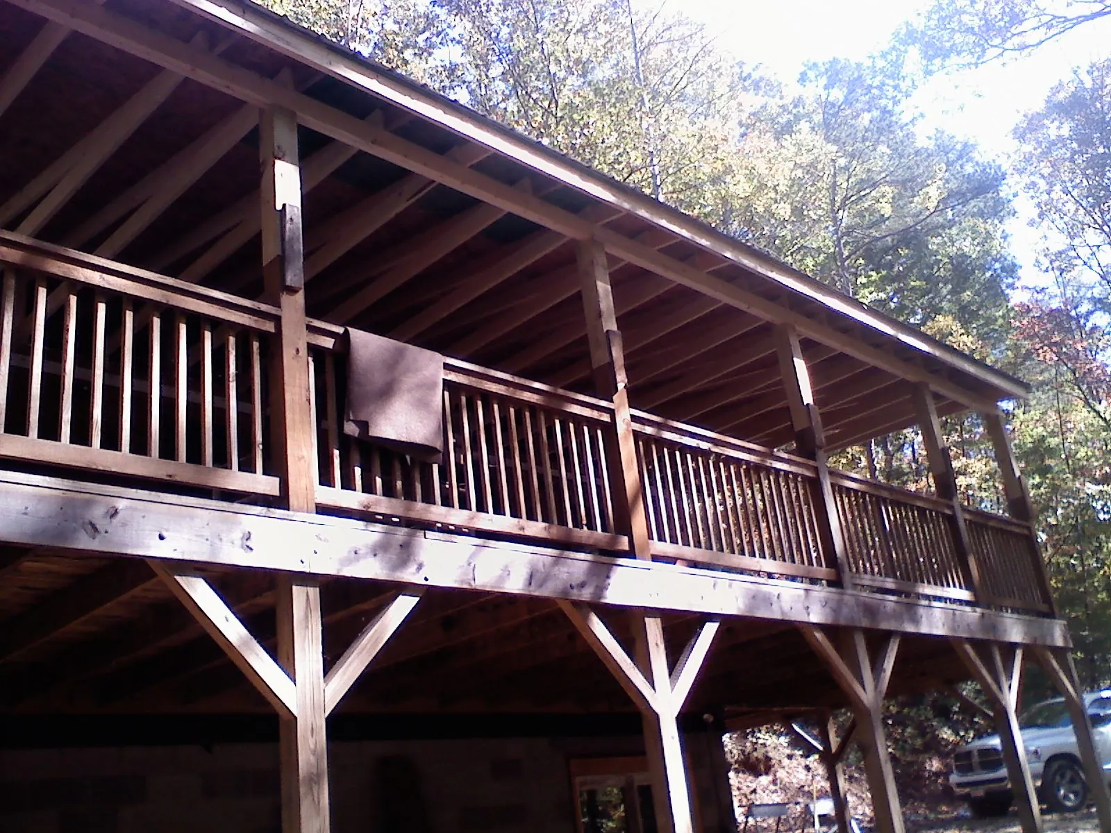 Timber framing under a new elevated porch and deck — Roof Leak Repair in Prairie City by Roofing Brothers